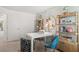 Inviting office space featuring stylish shelving, a modern desk, and comfortable seating at 2815 Habibi Ct, Buford, GA 30519