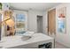 Well-lit office with a view, showcasing decor, modern desk, and functional shelving at 2815 Habibi Ct, Buford, GA 30519