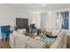 Bright living room with a large television, stylish chairs, and modern decor at 4962 Jatoba Rd, Acworth, GA 30101
