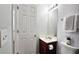 Functional bathroom featuring a vanity with storage, a well-lit mirror, and essential amenities for daily use at 5465 Mountain Top Pl, Cumming, GA 30041
