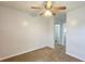 Bedroom with carpet flooring, ceiling fan, and neutral paint at 5465 Mountain Top Pl, Cumming, GA 30041