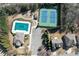 Aerial view of a community pool and tennis courts at 5760 Palmtree Pass, Cumming, GA 30040