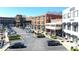 A busy parking area surrounded by stores and restaurants, offering convenient access to amenities at 5760 Palmtree Pass, Cumming, GA 30040