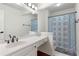 Bathroom featuring a vanity with drawers, a mirror, and a shower with a blue patterned shower curtain at 1440 Sandford Sw Trl, Lilburn, GA 30047