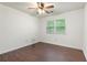 Clean bedroom featuring hardwood floors, a ceiling fan and natural light at 1440 Sandford Sw Trl, Lilburn, GA 30047