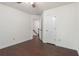 Clean bedroom with hardwood floors and a ceiling fan at 1440 Sandford Sw Trl, Lilburn, GA 30047