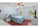Comfortable bedroom with ample natural light and ceiling fan at 1440 Sandford Sw Trl, Lilburn, GA 30047