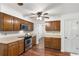 Functional kitchen with wood cabinets, stainless appliances, and ample counter space at 1440 Sandford Sw Trl, Lilburn, GA 30047