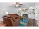 Comfortable living room features a fireplace, built-in bookshelves, and cozy seating at 1440 Sandford Sw Trl, Lilburn, GA 30047