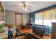 Bedroom featuring light hardwood floors and a fan at 2004 Poplar Falls Rd, Lithonia, GA 30058
