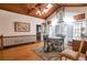 A dining room with hardwood floors, a wood ceiling, and a skylight at 2004 Poplar Falls Rd, Lithonia, GA 30058