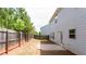 Spacious backyard featuring a wooden fence, a small concrete patio, and mature trees at 2352 Allman Dr, Jonesboro, GA 30236