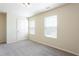 Open, airy bedroom with two windows and carpet flooring at 2352 Allman Dr, Jonesboro, GA 30236