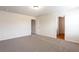 Spacious bedroom with neutral walls, carpet, and a view from its windows at 2352 Allman Dr, Jonesboro, GA 30236