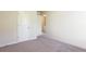 Cozy bedroom with neutral carpet and paint with a closet and doorway at 2352 Allman Dr, Jonesboro, GA 30236