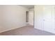 Well-lit bedroom with carpet and doors to other rooms at 2352 Allman Dr, Jonesboro, GA 30236