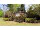 Stone community sign with brick planters and lush landscaping at 2352 Allman Dr, Jonesboro, GA 30236