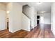Bright entryway with hardwood floors, leading to a staircase, view to bath, and access to other rooms at 2352 Allman Dr, Jonesboro, GA 30236