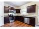 Beautiful kitchen with granite countertops, stainless steel appliances, ample cabinet space, and hardwood floors at 2352 Allman Dr, Jonesboro, GA 30236