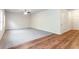 Open-concept living room featuring plush carpet, hardwood flooring, and ample natural light at 2352 Allman Dr, Jonesboro, GA 30236