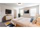 Comfortable main bedroom with a television, modern decor, and ample natural light at 2352 Allman Dr, Jonesboro, GA 30236