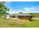 Brick house with backyard shed and paved patio area at 3050 Rebecca Sw Dr, Atlanta, GA 30311