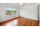 Bedroom features light-colored walls, hardwood floors, and a closet for optimal storage at 3050 Rebecca Sw Dr, Atlanta, GA 30311