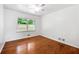 Bedroom featuring hardwood floors and a window with an outside view at 3050 Rebecca Sw Dr, Atlanta, GA 30311