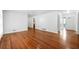 Open Living room featuring hardwood floors with doorways leading to the entrance and other rooms at 3050 Rebecca Sw Dr, Atlanta, GA 30311