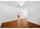 Living room featuring hardwood floors, bright walls and an opening to another room at 3050 Rebecca Sw Dr, Atlanta, GA 30311