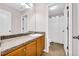 Well-lit bathroom featuring a vanity with countertop space and a separated shower/toilet area at 3178 Arbor Oaks Way, Snellville, GA 30039
