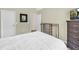 Bright bedroom with light-colored walls, modern furniture, and neutral decor for a calm aesthetic at 3178 Arbor Oaks Way, Snellville, GA 30039