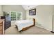 Bedroom with vaulted ceiling, dresser, and a large window at 3178 Arbor Oaks Way, Snellville, GA 30039