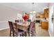 Open dining area with tile flooring, leading to kitchen and living room at 3178 Arbor Oaks Way, Snellville, GA 30039