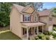 Charming home featuring a covered front porch, manicured landscaping and stone and vinyl facade at 3178 Arbor Oaks Way, Snellville, GA 30039