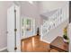 Bright foyer with hardwood floors, staircase, and natural light at 3178 Arbor Oaks Way, Snellville, GA 30039
