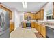 Updated kitchen with stainless appliances and granite countertops at 3178 Arbor Oaks Way, Snellville, GA 30039