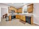 Well-lit kitchen with stainless steel appliances and granite countertops at 3178 Arbor Oaks Way, Snellville, GA 30039
