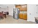 Kitchen with stainless steel refrigerator, tile backsplash and countertop at 3178 Arbor Oaks Way, Snellville, GA 30039