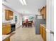 Bright kitchen features stainless steel appliances and ample cabinet space at 3178 Arbor Oaks Way, Snellville, GA 30039