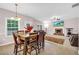 Bright living room featuring a cozy fireplace and lots of natural light at 3178 Arbor Oaks Way, Snellville, GA 30039