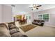 Spacious living room with view of kitchen, dining area, and comfortable sofas at 3178 Arbor Oaks Way, Snellville, GA 30039