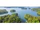 Stunning aerial view of serene waters with lush green islands, perfect for boating or enjoying nature at 7830 Kings Point Dr, Cumming, GA 30041