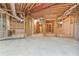 Spacious unfinished basement with utilities in view, ideal for future customization at 7830 Kings Point Dr, Cumming, GA 30041