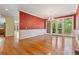 Dining area featuring hardwood floors, elegant chandelier, and access to outdoor deck at 7830 Kings Point Dr, Cumming, GA 30041
