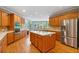 Open kitchen area with stainless steel appliances, a center island, and a breakfast nook at 7830 Kings Point Dr, Cumming, GA 30041