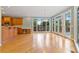 Bright open living area with hardwood floors, french doors, and an adjacent kitchen space at 7830 Kings Point Dr, Cumming, GA 30041