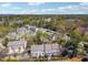Residential community showcasing a collection of well-maintained townhomes nestled among mature trees at 1236 Brickton Nw Dr, Atlanta, GA 30318