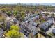 Aerial view of a neighborhood featuring townhomes surrounded by lush trees and landscaping at 1236 Brickton Nw Dr, Atlanta, GA 30318