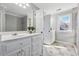 Bathroom showcasing a vanity with a sink, and a tiled shower, providing comfort and convenience at 1236 Brickton Nw Dr, Atlanta, GA 30318